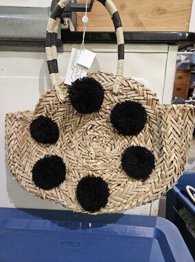 Woven Straw Tote with Black Pom-Pom Accents
